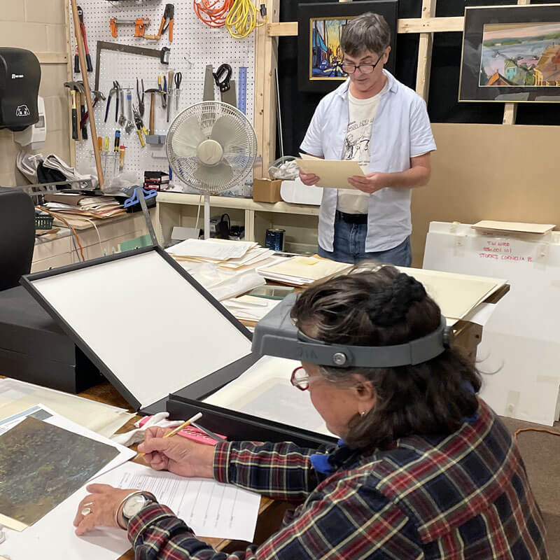 Volunteers working in the archives room at the T.W. Wood Museum