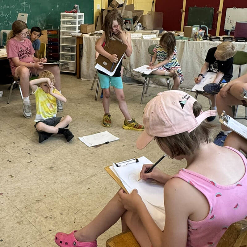 A group of youth drawing