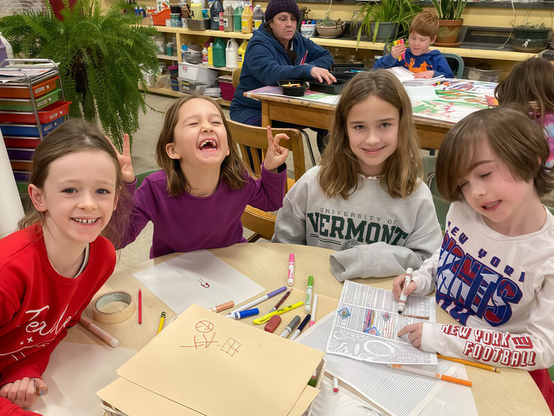 Happy laughing kids working on artwork projects