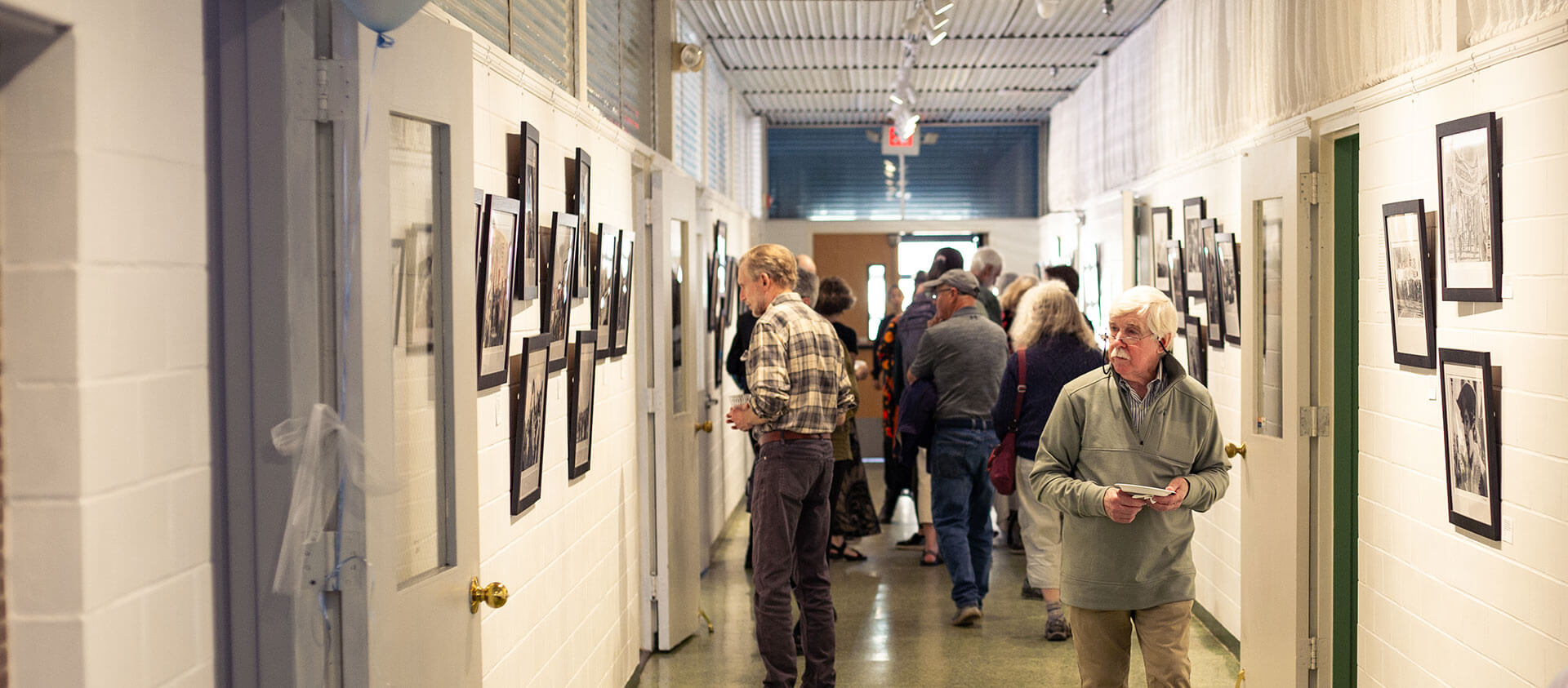 People looking at artwork in the Contemporary Hall exhibit