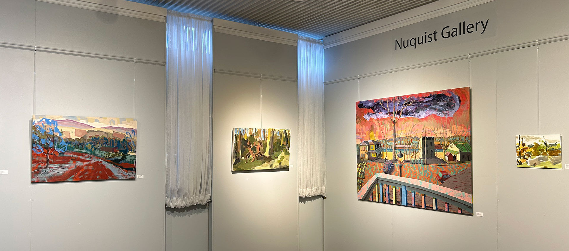 Artwork hangin on the walls inthe Nuquist Gallery at T.W. Wood Gallery