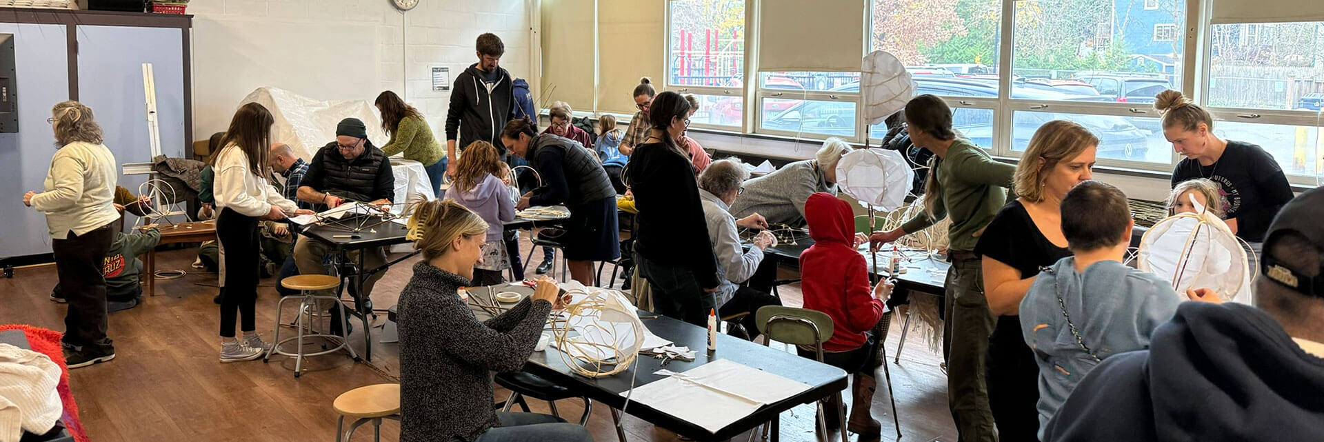 People busy creating lanterns at a workshop