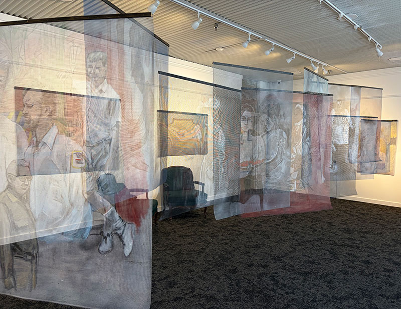 Suspended painted screens by Charlet Davenport in Nuquist Gallery